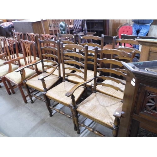 312 - A set of six of George III style oak rush seated ladderback chairs