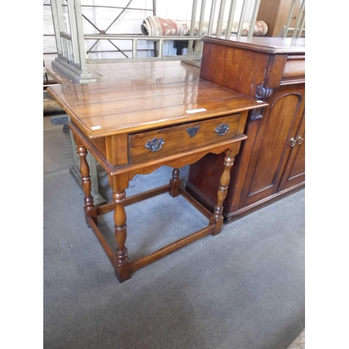 317 - An 18th Century style hardwood single drawer side table