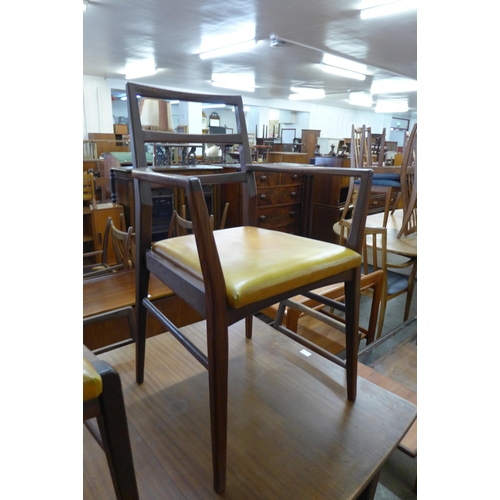 32 - A Fyne Ladye afromosia extending dining table and six chairs, designed by Richard Hornby