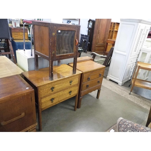 324 - Two oak chests of drawers and a record cabinet