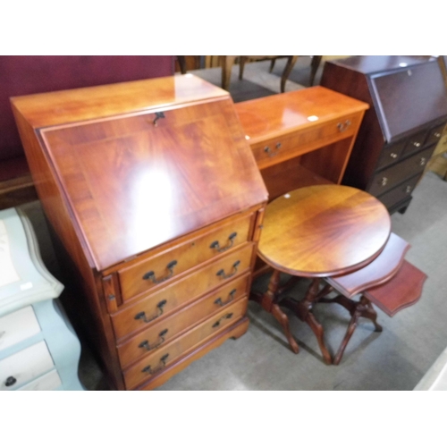 330 - An inlaid mahogany bureau, a yew wood open bookcase and a nest of tables