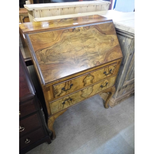 332 - A Queen Anne style figured walnut bureau de dame