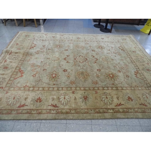 353 - A large eastern beige ground rug