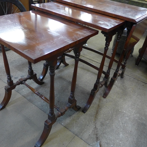 359 - A mahogany drop-leaf nest of tables, a circular occasional table and a wrought steel and hardwood oc... 