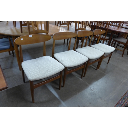 36 - A set of four teak dining chairs