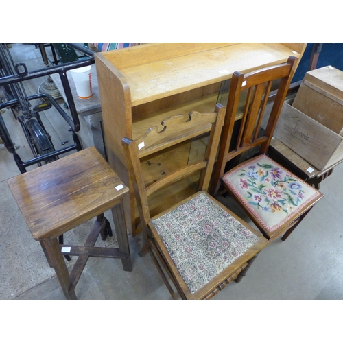 360 - A light oak bookcase, two chairs, an oak nest of tables, two wooden boxes, etc.