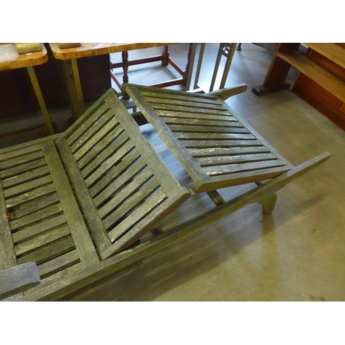 366 - A teak reclining sun lounger