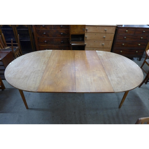 38 - A Danish Andreas Tuck teak extending dining table, designed by Hans Wegner