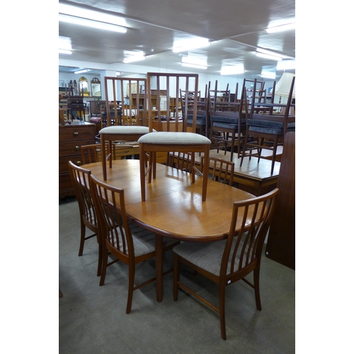 39 - A McIntosh teak extending dining table and eight chairs