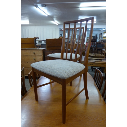 39 - A McIntosh teak extending dining table and eight chairs