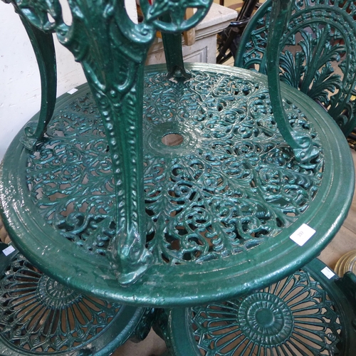 397 - A painted cast alloy garden table and four chairs