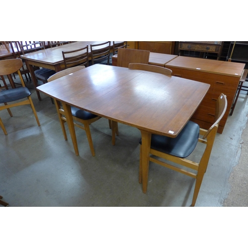 42 - A teak extending dining table and six chairs