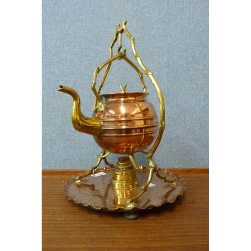 443 - An Arts and Crafts copper and brass kettle on stand, manner of W.A.S. Benson