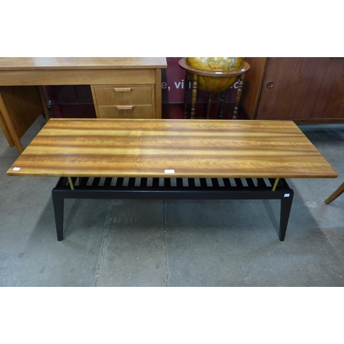 46 - A tola wood and black coffee table