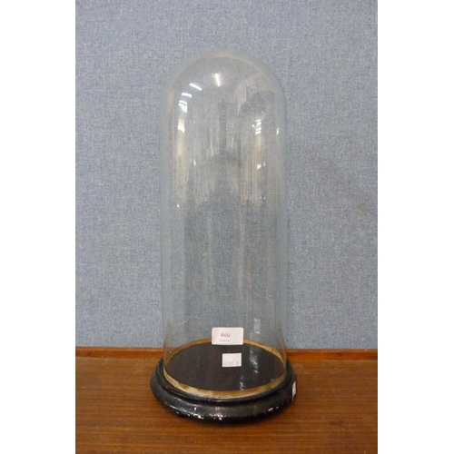 460 - A Victorian glass dome, on ebonised base