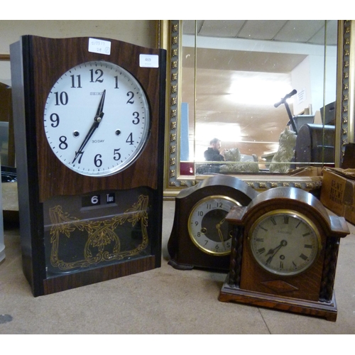 469 - A Seiko 30-day clock, a Smiths Enfield Bakelite clock and an oak cased mantel clock