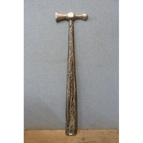 479 - A large wall hanging aluminium shop display hammer