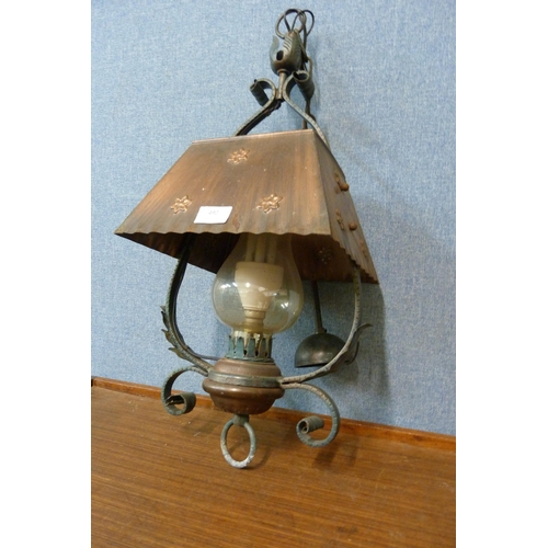 492 - An Arts and Crafts wrought iron and copper hanging ceiling lantern