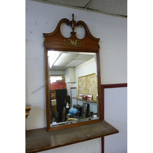 497 - A French Empire style walnut and parcel gilt framed mirror