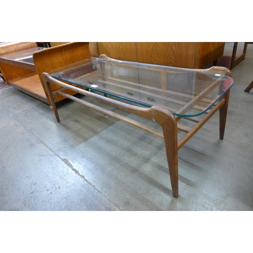 56 - A Danish teak and glass topped rectangular coffee table