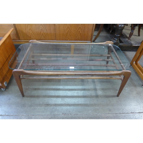 56 - A Danish teak and glass topped rectangular coffee table