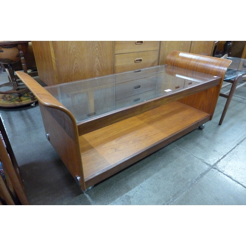 57 - A G-Plan teak and glass topped tulip coffee table