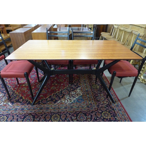 64 - A G-Plan Librenza tola wood and black helicopter dining table and six chairs