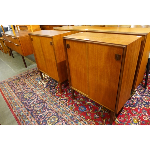 65 - A pair of Beaver & Tapley teak two door bookcases