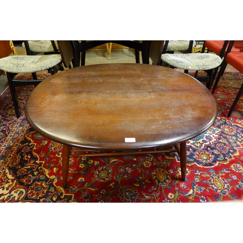 67 - An Ercol Golden Dawn elm and beech Windsor coffee table