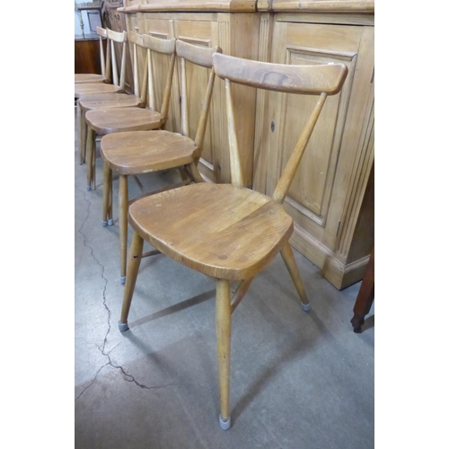 68 - A set of six Ercol Blonde elm and beech 392 adult model stacking chairs