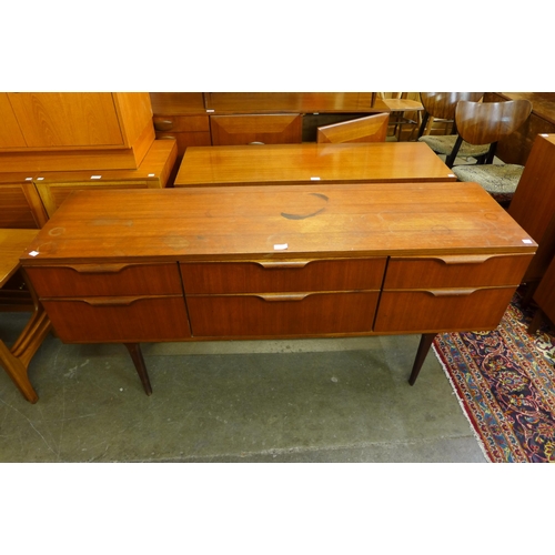 70 - An Austin Suite teak six drawer sideboard