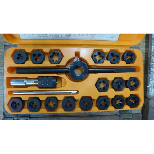 2054 - Three pipe threading toolboxes including an assortment of different sized taps and dies