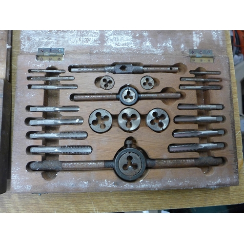 2054 - Three pipe threading toolboxes including an assortment of different sized taps and dies