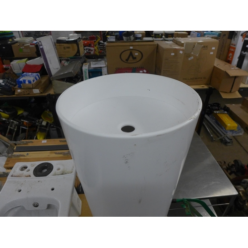 2322 - A white pedestal sink and a white toilet basin and cistern