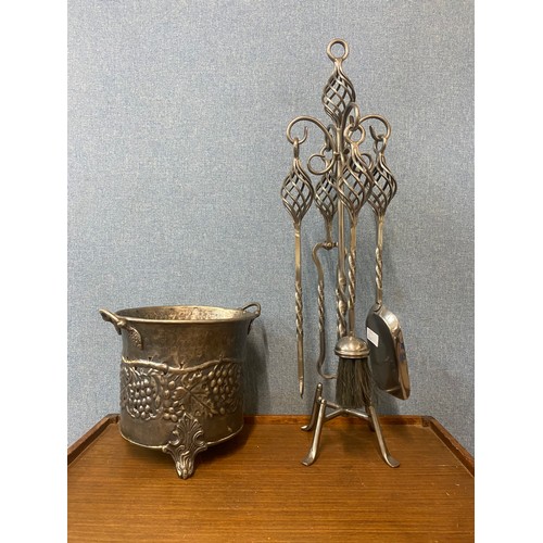 373A - A wrought steel companion set on stand and a wine cooler