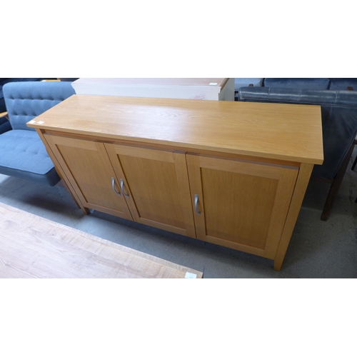 1588 - An oak three door sideboard