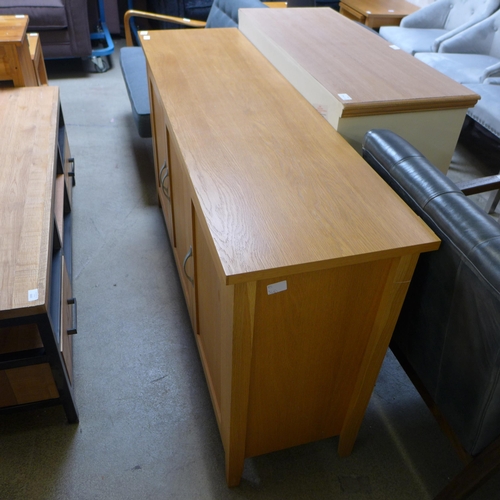 1588 - An oak three door sideboard