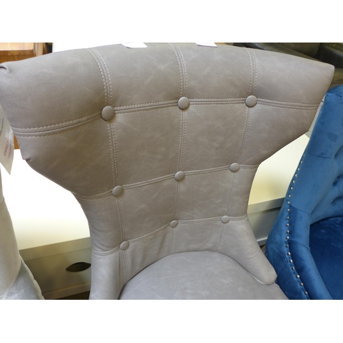 1601 - A grey buttoned side chair- damaged * this lot is subject to VAT