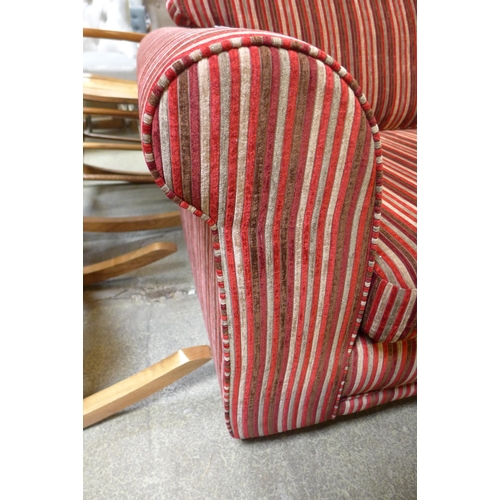 1609 - A red and brown striped upholstered three seater sofa