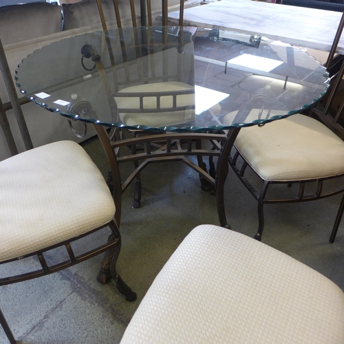 1648 - A glass topped circular dining table and four chairs