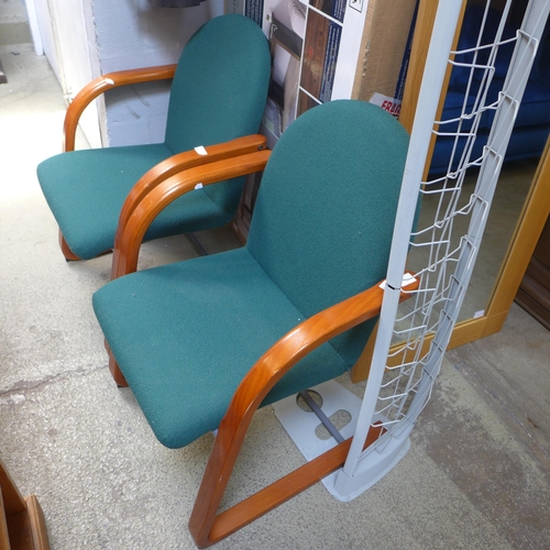 1674 - A pair of office chairs and a display rack