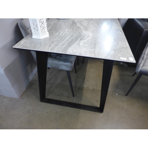 1307 - A Morada marble effect fixed top dining table with a set of four silver pinched back velvet dining c... 