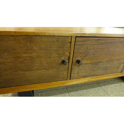 1330 - A Phoenix two door, single shelf TV unit * this lot is subject to VAT