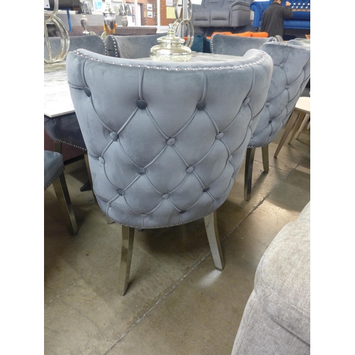 1362 - A Kos marble effect extending dining table with a set of six Marvel grey button back and studded din... 