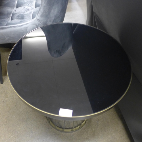 1395 - A brass effect and black glass top lamp table