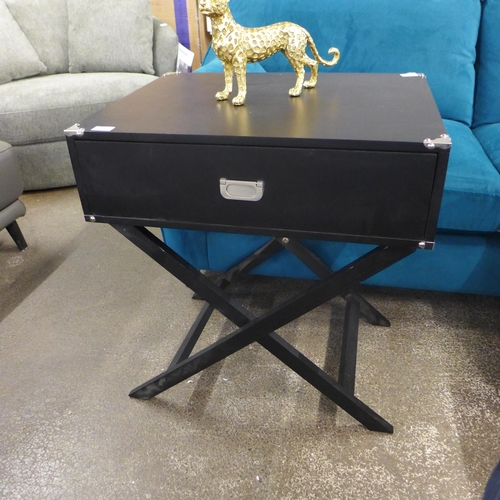 1470 - A black side table with cross legs