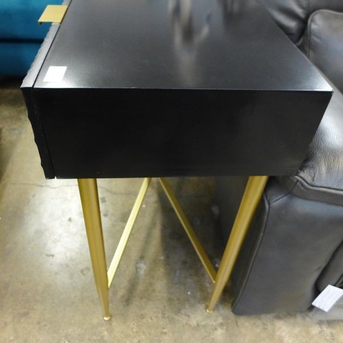 1476 - A black console table with gold legs