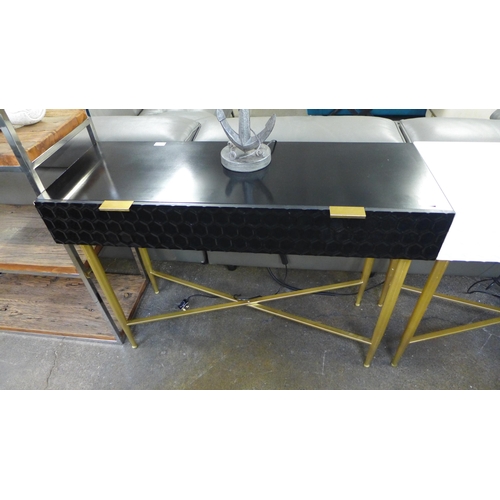 1486 - A black console table with gold legs