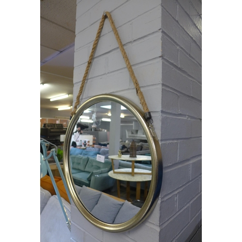 1530 - A medium round champagne colour metal mirror on a hanging rope H46cm (JRG1509)