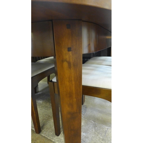 1536 - A Laura Ashley chestnut oval extending dining table and four chairs, 180cm extending to 225cm, width... 